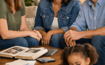 Adoptive parents and birth mother warmly interacting in a cozy living room while a happy child plays nearby, representing a positive open adoption family connection.